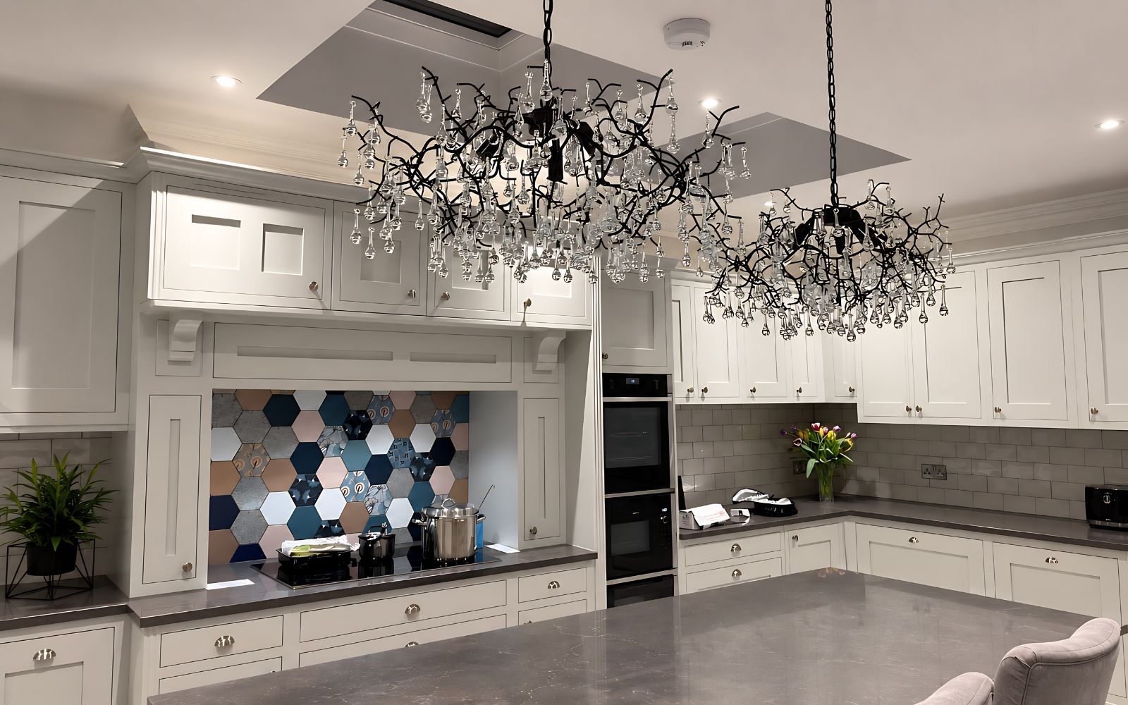 Bespoke alcove units with illuminated shelves and painted cabinets